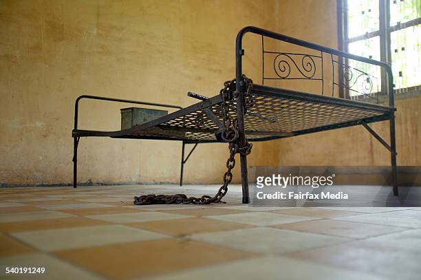 Prison. Tuol sleng the former khmer rouge s 21 prison, phnom penh, cambodia. One of the class rooms used to torture prisoners, with the iron bed,...