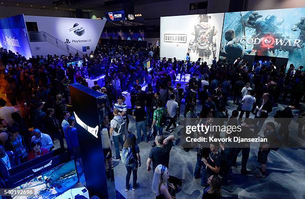 Gamers try out new video game in the Sony Playstation booth during the annual E3 2016 gaming conference at the Los Angeles Convention Center on June...