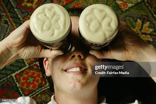 St Patrick's Day 2004. Lil Magill of Unanderra gets the beer googles on with a pair of shamrock-festooned pints of Guinness as she prepares for St...