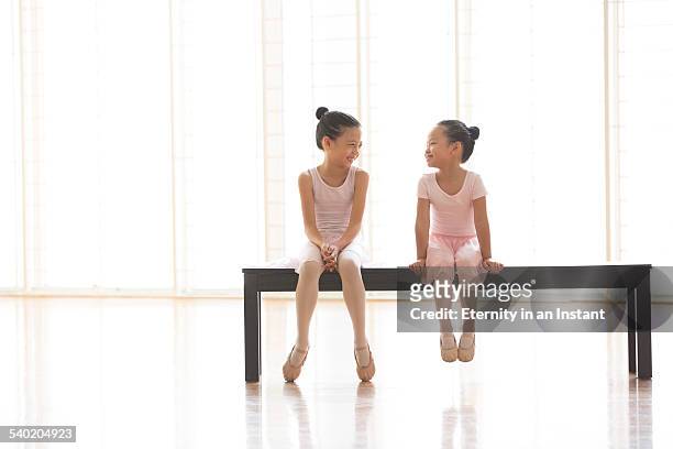 young ballerinas waiting for class - singapore school stock-fotos und bilder