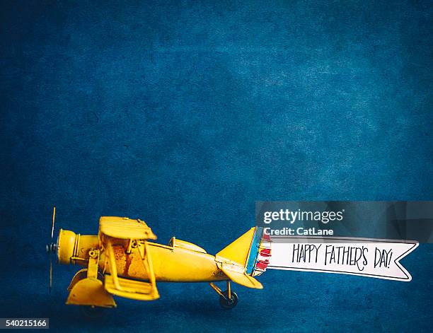 happy father's day! vintage airplane with handmade banner - welcome yellow stock pictures, royalty-free photos & images