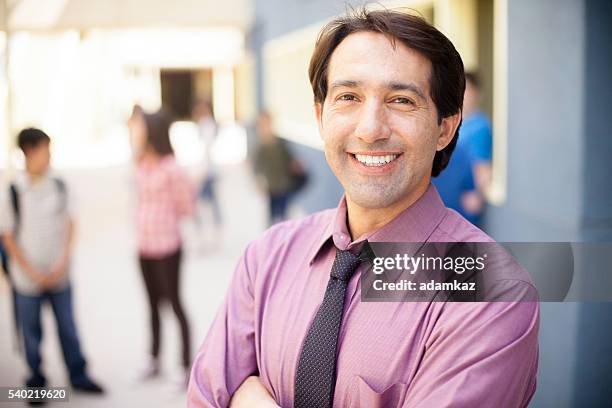 school principal smiling in front of students on campus - educational establishment stock pictures, royalty-free photos & images