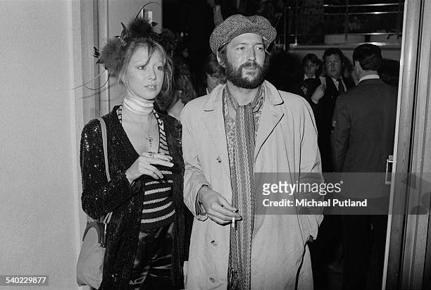British musician Eric Clapton and his girlfriend, Pattie Boyd, at the premiere of Ken Russell's film version of The Who's rock opera 'Tommy' at the...