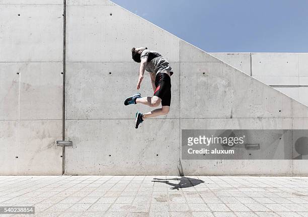 man jumping high - men's field event stockfoto's en -beelden