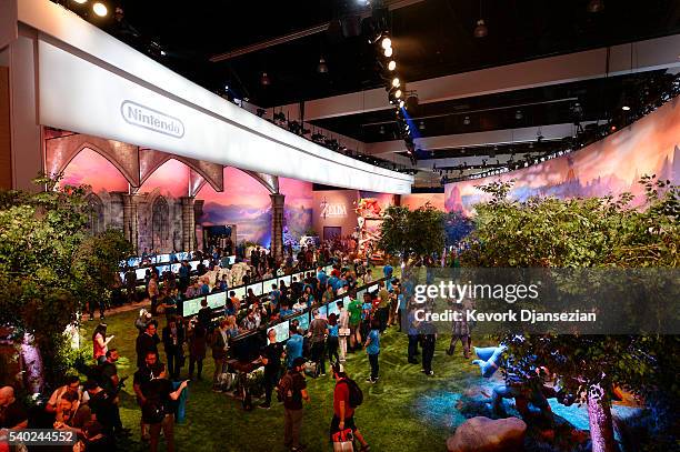 Gamers try out the new to play the new video game "The Legend of Zelda: Breath of the Wild" in the Nintendo booth during the annual E3 2016 gaming...