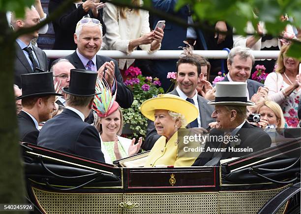 Queen Elizabeth ll and Prince Philip, Duke of Edinburgh arrive in an open carriage to attend Day 1 of Royal Ascot on June 14, 2016 in Ascot, England.