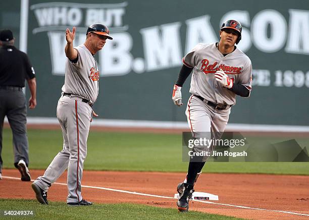 Manny Machado of the Baltimore Orioles celebrates his two-run home run with Bobby Dickerson of the Baltimore Orioles in the first inning against the...