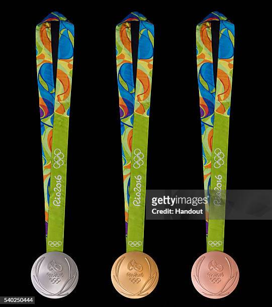 In this handout provided by Jogos Rio 2016, the front of the gold, silver and bronze medals for the 2016 Summer Olympics is shown June 8, 2016 in Rio...