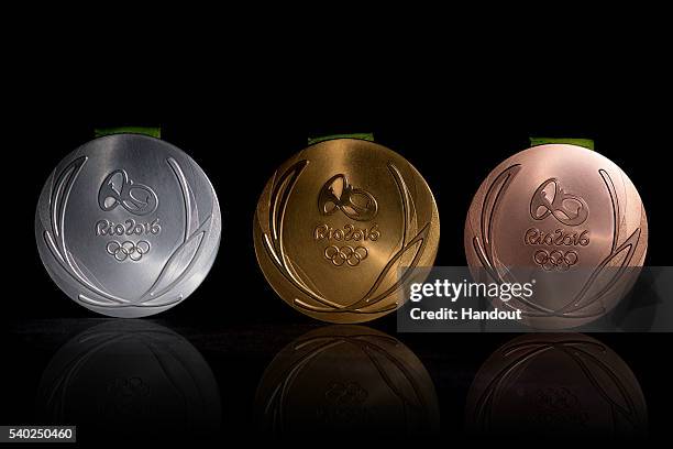 In this handout provided by Jogos Rio 2016, the front of the gold, silver and bronze medals for the 2016 Summer Olympics are shown June 8, 2016 in...