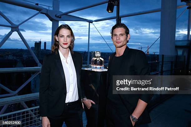 Egeria of YSL Beauty, model Crista Cober and actor Jeremie Laheurte attend YSL Beauty launches the new Fragrance "Mon Paris" at Cafe Le Georges on...