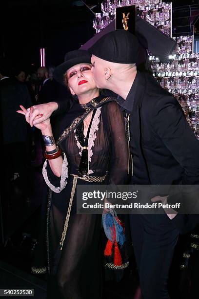 Catherine Baba and photographer Ali Mahdavi attend YSL Beauty launches the new Fragrance "Mon Paris" at Cafe Le Georges on June 14, 2016 in Paris,...