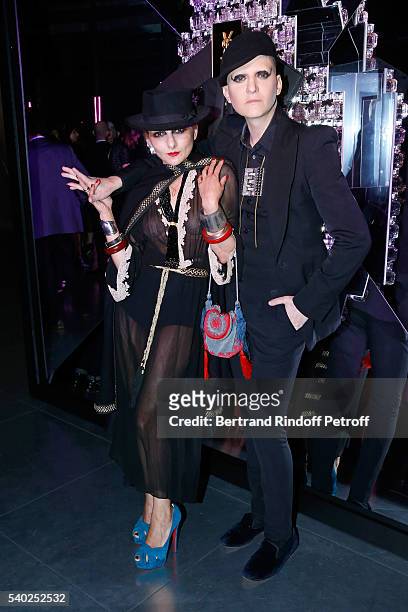 Catherine Baba and photographer Ali Mahdavi attend YSL Beauty launches the new Fragrance "Mon Paris" at Cafe Le Georges on June 14, 2016 in Paris,...