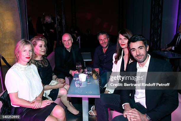 Actresses Karin Viard, Catherine Deneuve, General Director of of Yves Saint Laurent, Stephan Bezy, Carl Ganem, actress Marina Hands and guest attend...