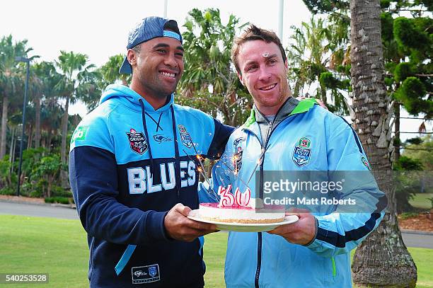 Michael Jennings presents James Maloney with a birthday cake during a New South Wales Blues State of Origin NSW Blues media opportunity on June 15,...