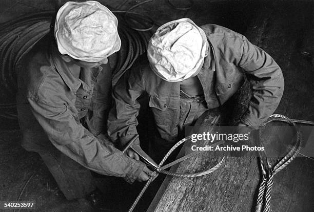 Swiss marines work in the port of Basel, Switzerland. Circa 1960.