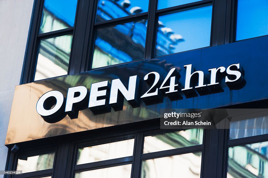 Open 24 hours sign, on building