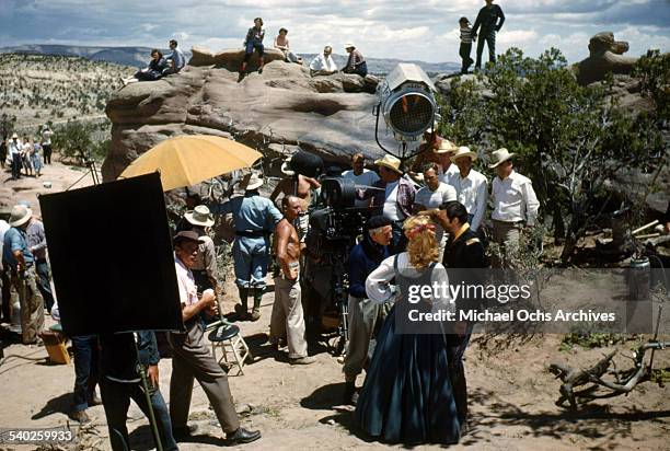 Actress Patrice Wymore gets ready on set as she listens to director William Keighley, as a film crew films the movie "Rocky Mountain" on location in...