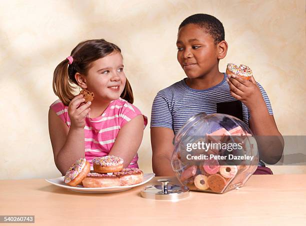 kids eating unhealthy food - child cookie jar stock pictures, royalty-free photos & images