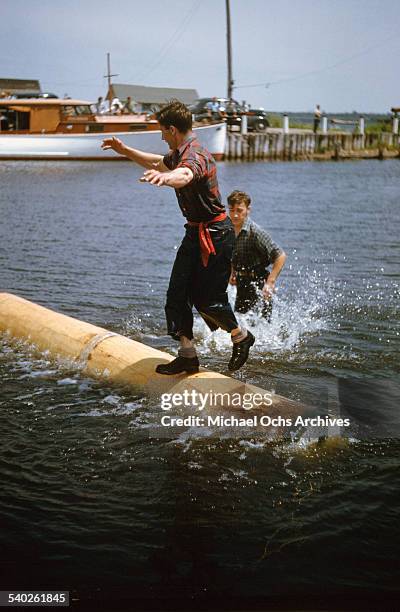 Man Log Riding Log Rolling Competition Photos and Premium High Res Pictures - Getty Images