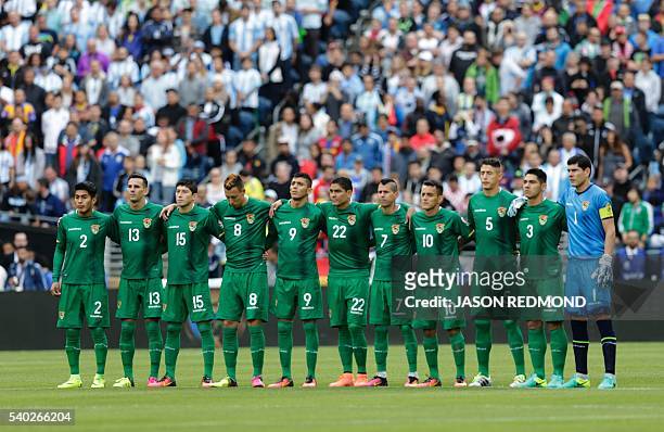 Players of Bolivia pay a minute of silence in honour of the victims of a rampage at a gay club in Orlando, Florida, before the start of the Copa...
