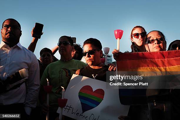 Attendees listen to speakers at a memorial gathering for those killed in Orlando at Grand Army Plaza on June 14, 2016 in the Brooklyn borough of New...