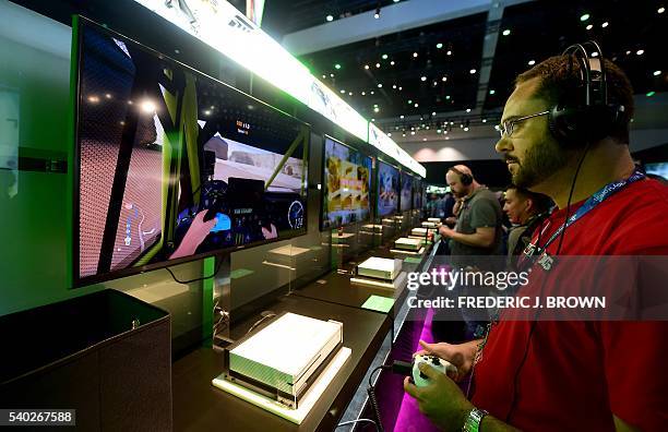 People play 'Forza Horizon 3' during the 2016 Electronic Entertainment Expo annual video game conference and show on June 14, 2016 in Los Angeles,...