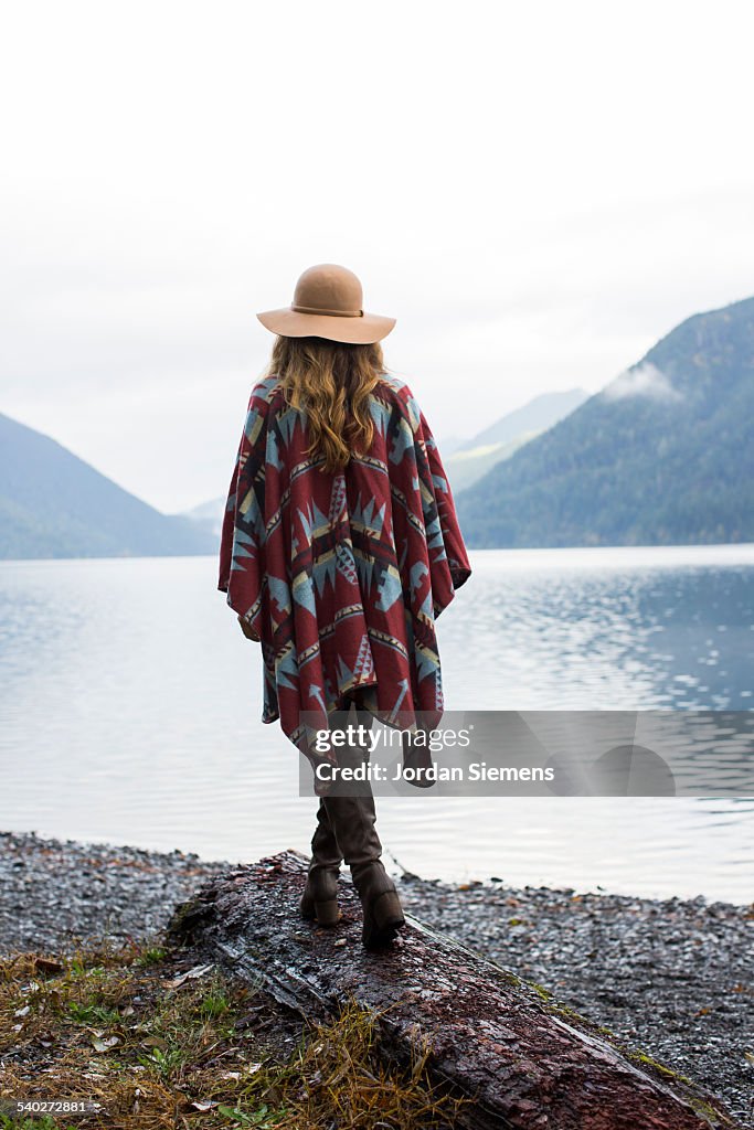 A woman in a hat and wool jacket.