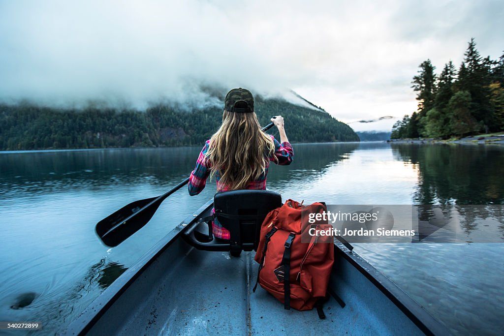 A woman in a canoe.