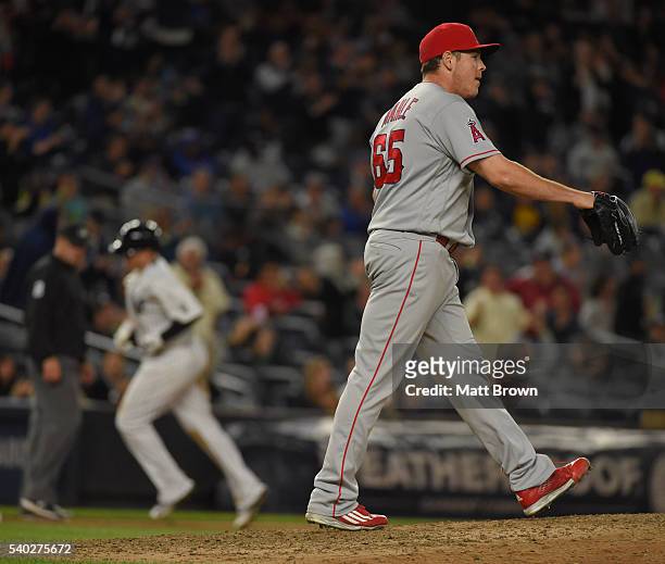 Relief pitcher Greg Mahle of the Los Angeles Angels of Anaheim reacts after allowing a two-run home run to Chris Parmelee of the New York Yankees...