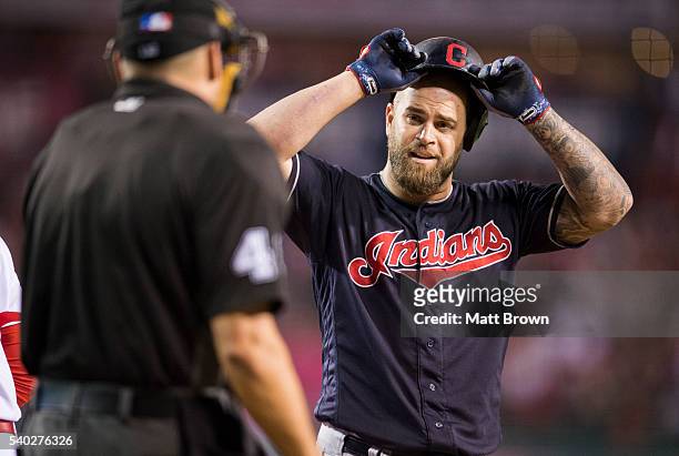 Mike Napoli of the Cleveland Indians argues with umpire Andy Fletcher after being called out on strikes during the fourth inning of the game against...