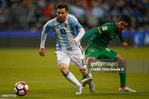 Lionel Messi of Argentina dribbles against Danny Bejarano of Bolivia during the 2016 Copa America Centenario Group D match at CenturyLink Field on...