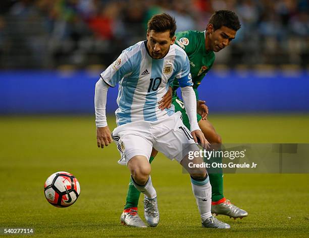 Lionel Messi of Argentina dribbles against Danny Bejarano of Bolivia during the 2016 Copa America Centenario Group D match at CenturyLink Field on...