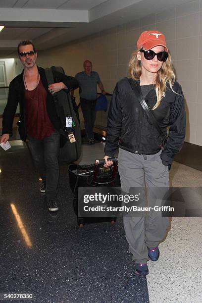 Renee Zellweger and Doyle Bramhall are seen at LAX on June 14, 2016 in Los Angeles, California.