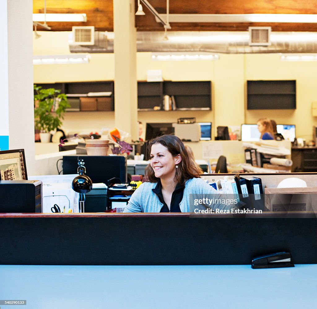 Smiling portrait of woman in office