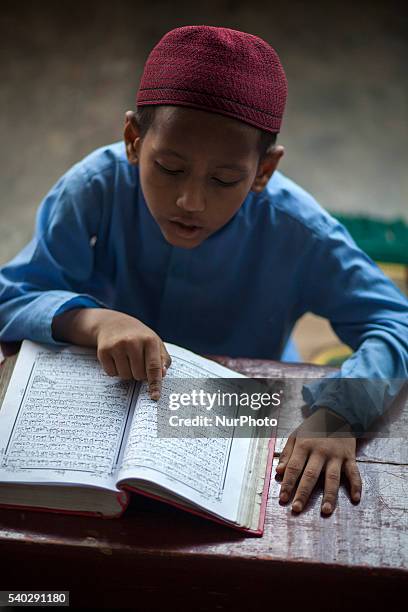 Students recite from the Quran at a madrasa in Old Dhaka during Ramadan in Dhaka, Bangladesh on June 14, 2016. Muslims around the world are observing...