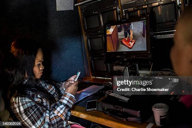 Members of the SABC tweet as they watch a live feed from just outside the North Gauteng High Court as Oscar Pistorius demonstrates his condition for...