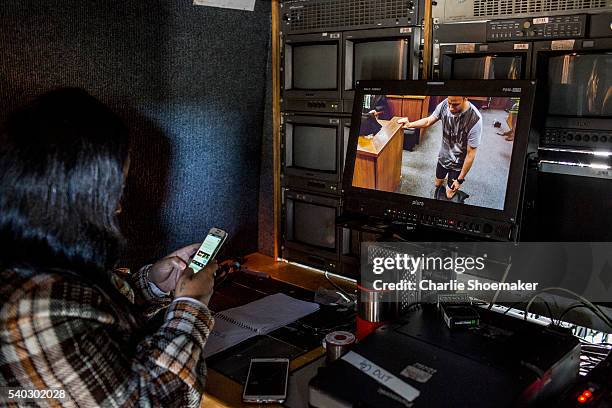 Members of the SABC tweet as they watch a live feed from just outside the North Gauteng High Court as Oscar Pistorius demonstrates his condition for...