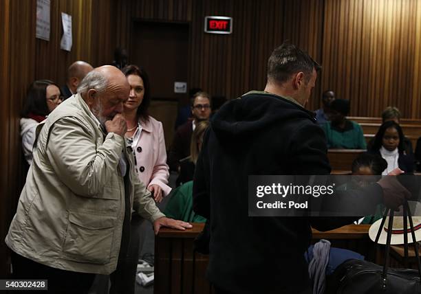 Father of Reeva Steenkamp, Barry Steenkamp watches as Oscar walks without his prosthetic legs during the third day of Oscar's hearing for a...