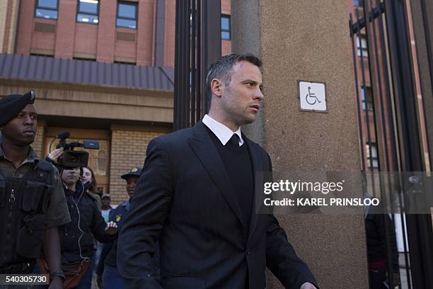 South African Paralympic athlete Oscar Pistorius leaves the Pretoria High Court during a lunch break on June 15 the third day of pre-sentencing...