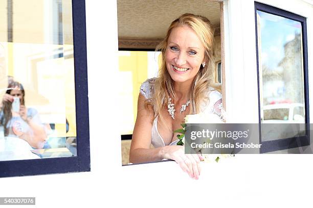 Bride Renata Kochta, wearing a Dirndl by Astrid Soell during the wedding of Renata Kochta and Thomas Frank at the registry office at Mandlstrasse on...