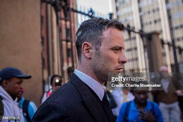 Oscar Pistorius leaves the North Gauteng High Court for lunch after removing his removing prosthetic legs earlier by his defense counsel Barry Roux...