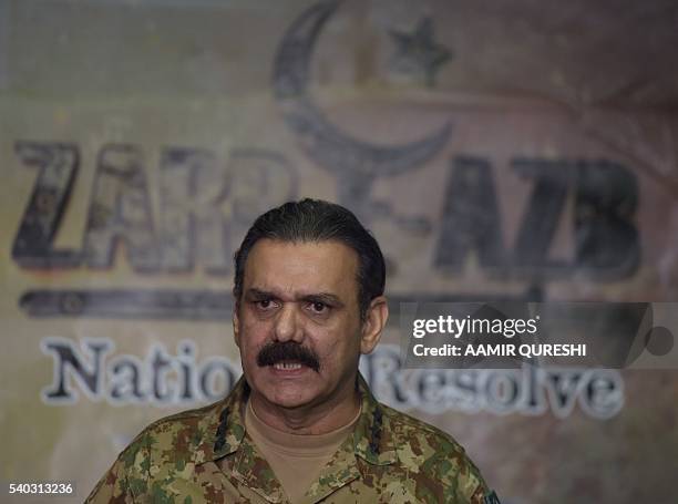 Pakistan's army spokesman, Asim Saleem Bajwa addresses media representatives about the details of military operation, Zarb-e-Azb, in Rawalpindi on...