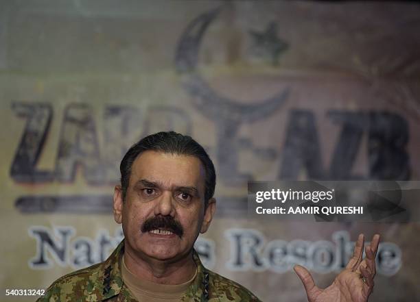 Pakistan's army spokesman, Asim Saleem Bajwa addresses media representatives about the details of military operation, Zarb-e-Azb, in Rawalpindi on...