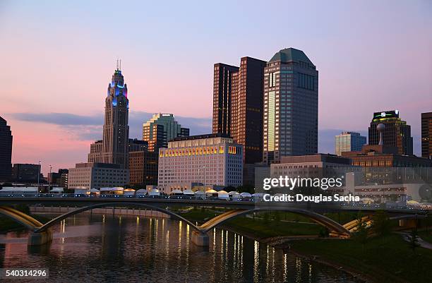 columbus city skyline along scioto river at twilight, columbus, ohio, usa - columbus ohio aerial stock pictures, royalty-free photos & images