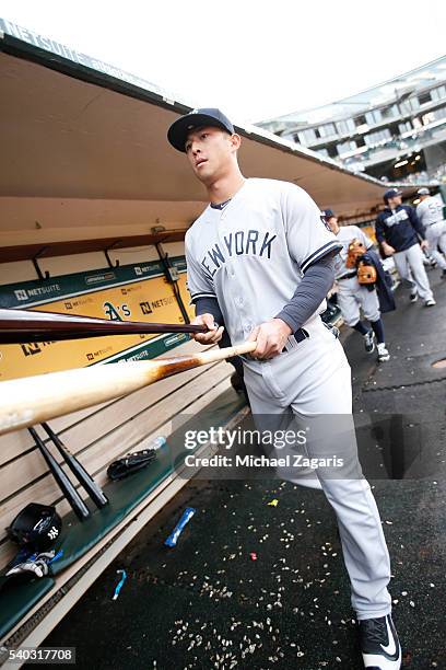 Dustin Ackley of the New York Yankees stands in the dugout prior to the game against the Oakland Athletics at the Oakland Coliseum on May 19, 2016 in...