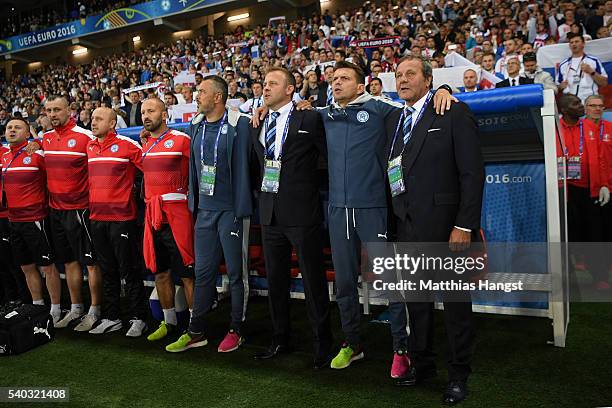 Jan Kozak head coach of Slovakia and his backroom staff look on during the natinoal anthem during the UEFA EURO 2016 Group B match between Russia and...