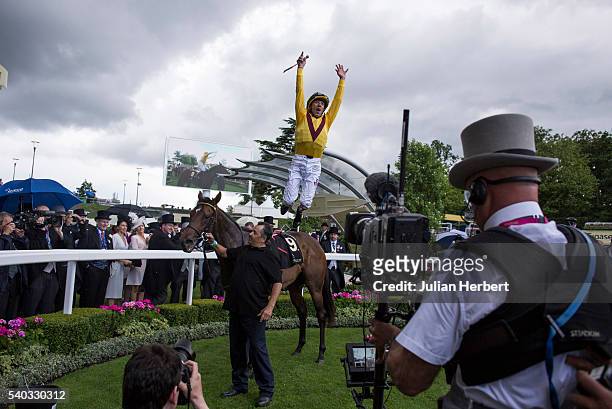 Frankie Dettori jumps from Lady Aurelia after winning The Queen Mary Stakes Race run during Day Two of Royal Ascot at Ascot Racecourse on June 15,...