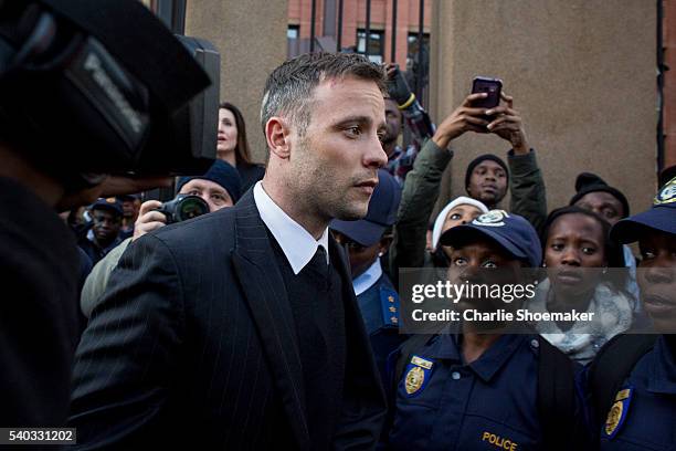 Oscar Pistorius leaves the North Gauteng High Court at the end of the third day of his resentencing hearing at Pretoria High Court on June 15, 2016...