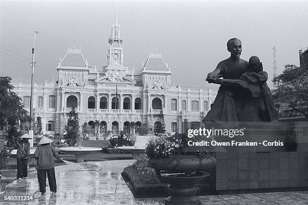 Statue of Ho Chi Minh stands before city hall in Ho Chi Minh City, Vietnam.