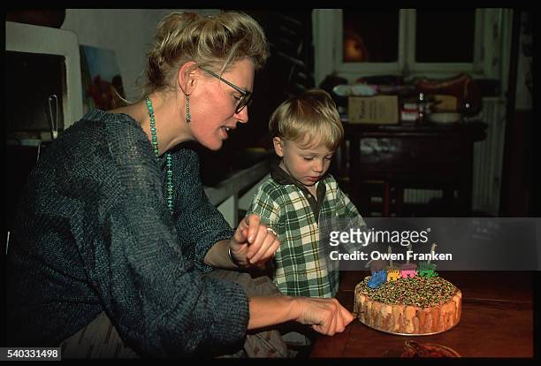 mother and child with birthday cake - 1990s woman stock pictures, royalty-free photos & images